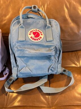 Fjallraven Kanken Backpack in Light Blue with Red Logo